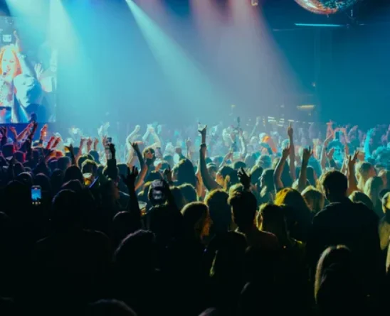 Crowd singing along at a Kylie Fisher piano party show