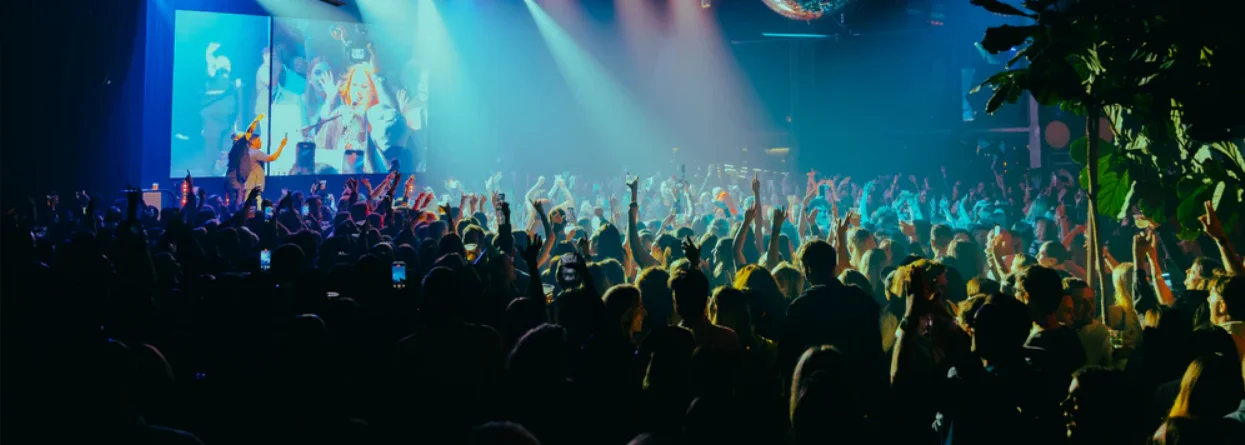 Crowd singing along at a Kylie Fisher piano party show