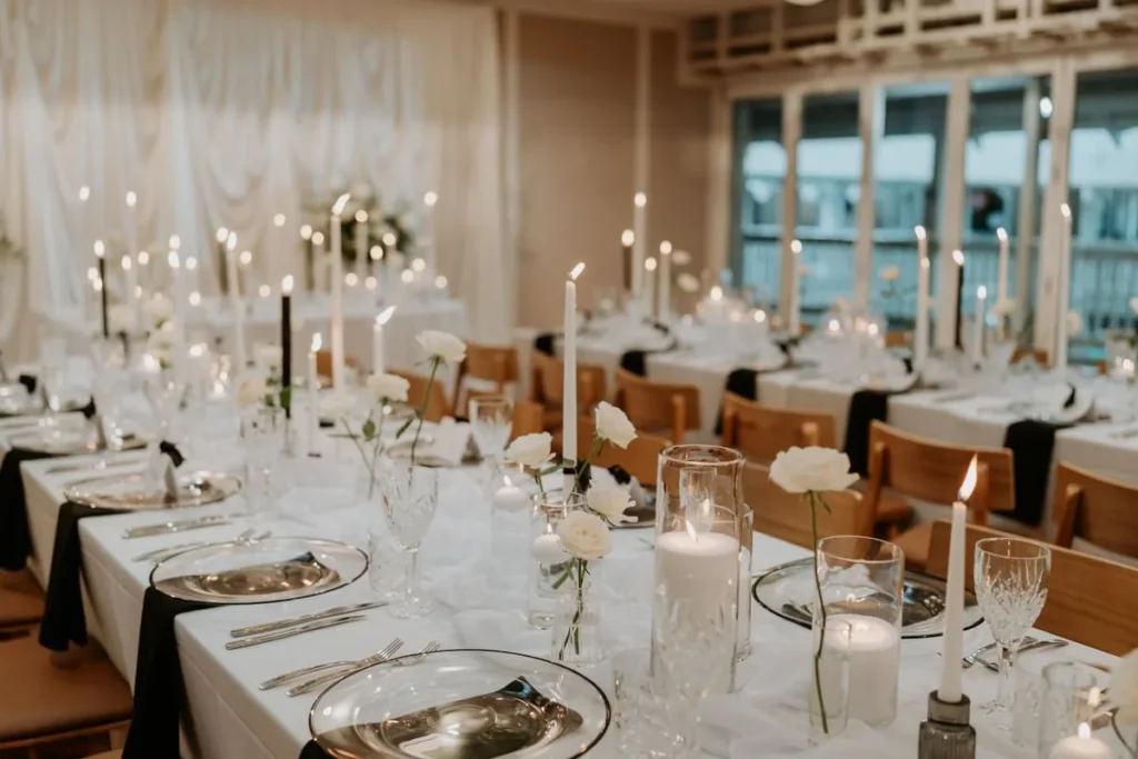 Candlelit wedding reception tables at Wharf Events
