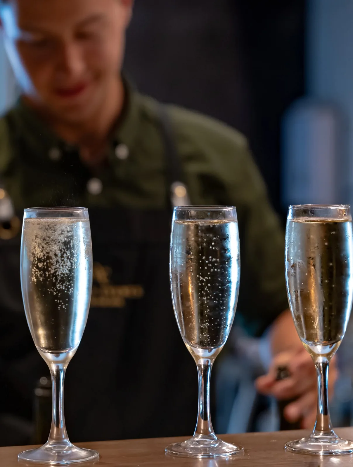 Champagne being poured at the private bar at Wharf Events