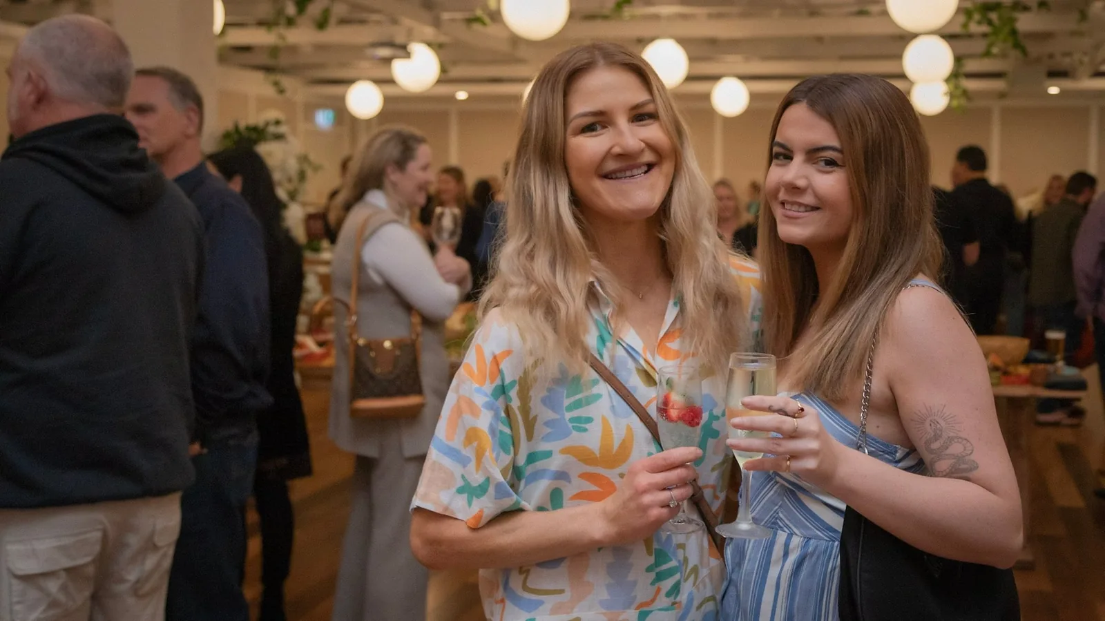 Guests celebrating with drinks at Wharf Events